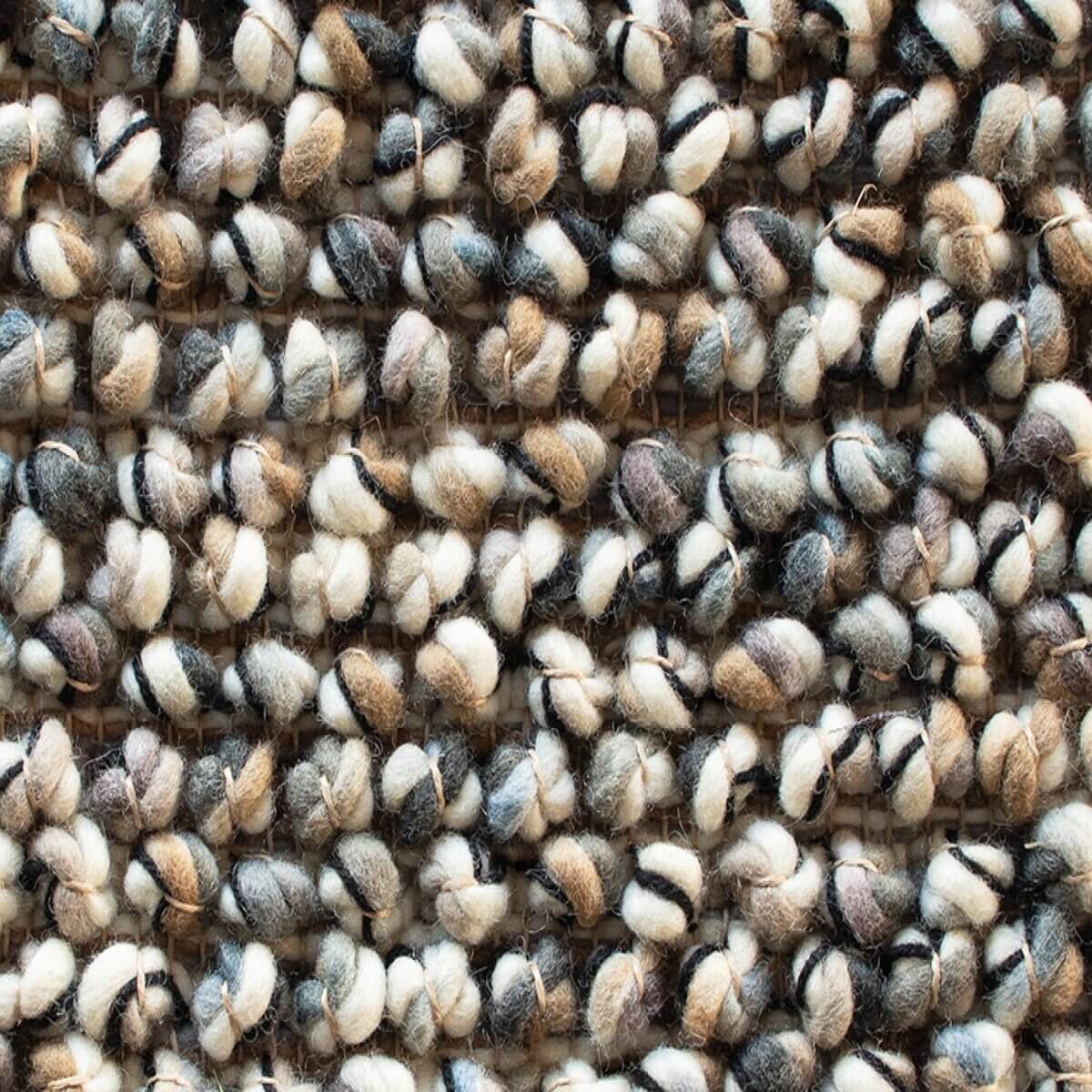 Alfombra Marble de Brink & Campman en diseño empedrado, tejida a mano en pura lana virgen.