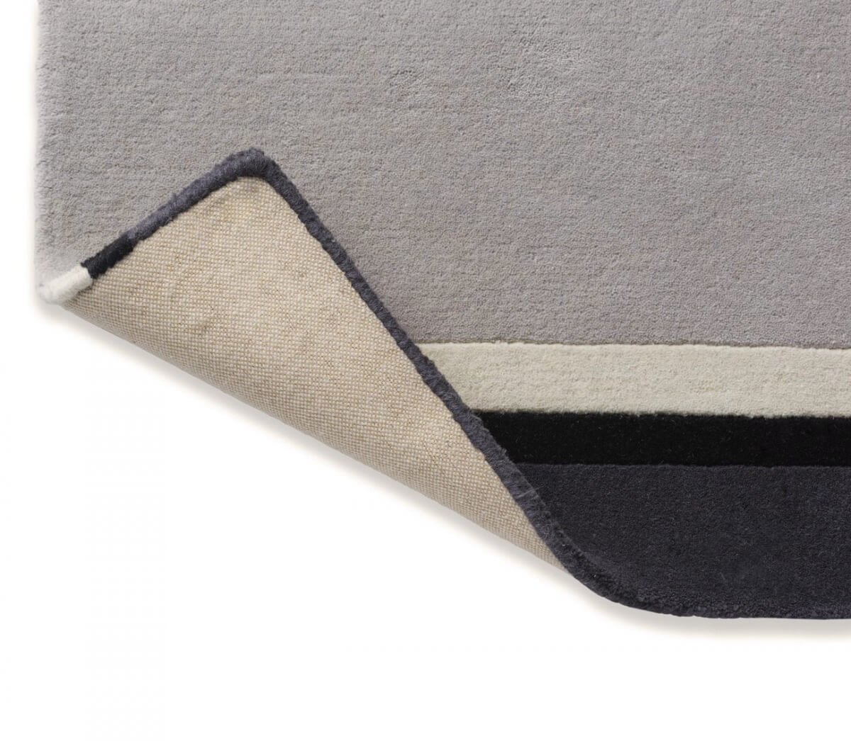 Alfombra Laura Ashley Eato, diseño lineal contemporáneo, fabricada a mano en lana pura.